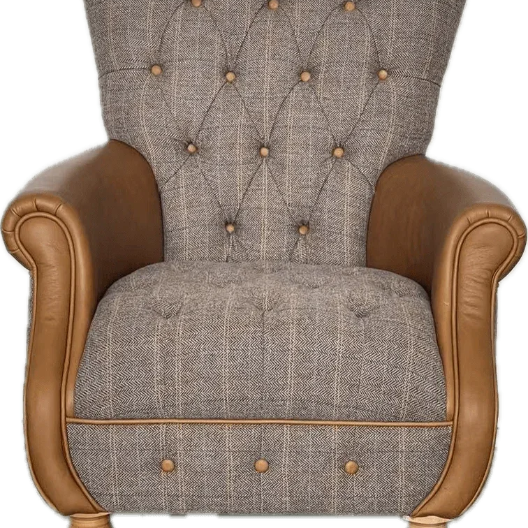 Button-tufted armchair with grey herringbone fabric and tan leather arms and wooden legs