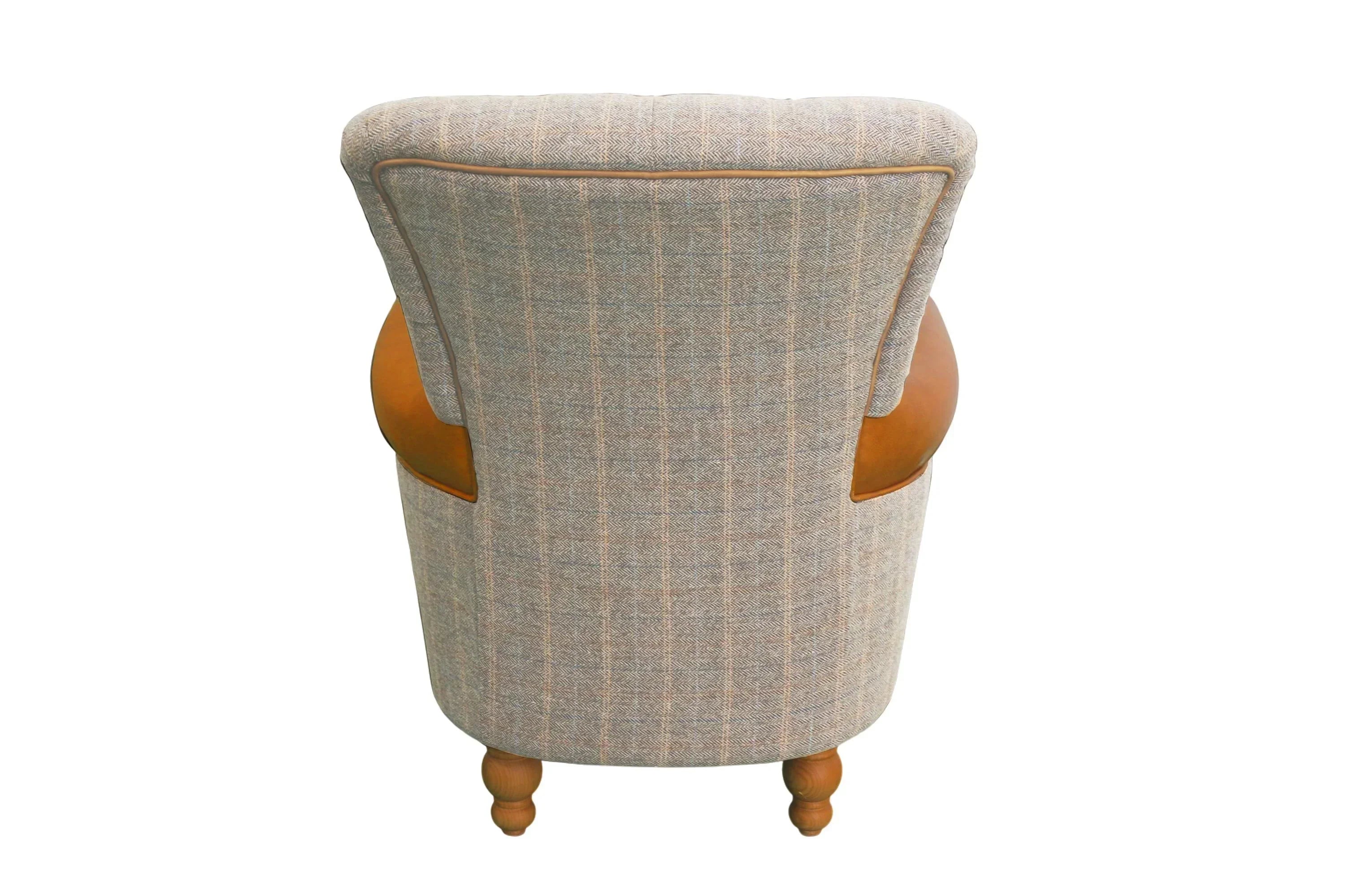 Back view of grey accent armchair with fabric upholstery and tan faux leather panels