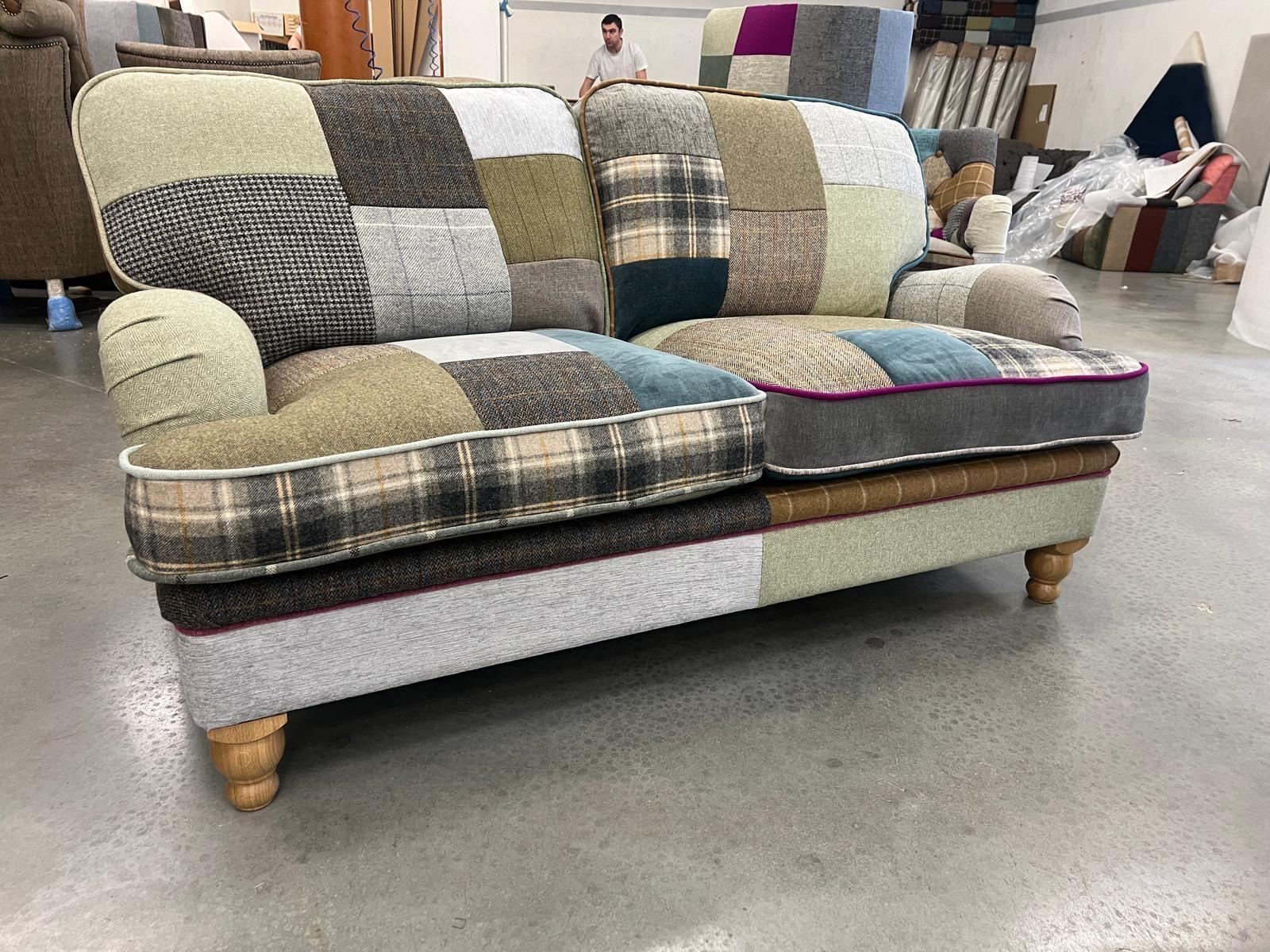 Patchwork fabric sofa with wooden legs in workshop setting
