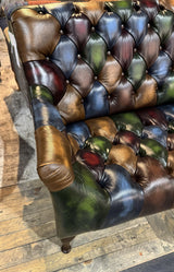 Tufted leather sofa with multicolour patchwork upholstery and wooden legs