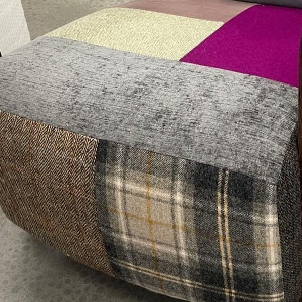 Patchwork fabric ottoman with grey, plaid, herringbone, cream and purple upholstery