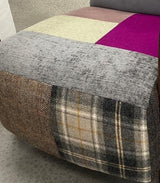 Patchwork fabric ottoman with grey, plaid, herringbone, cream and purple upholstery