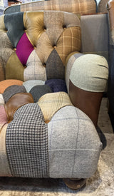 Patchwork fabric sofa with button-tufted upholstery, mixed tweed and leather details