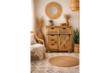 The rustic cabinet features a natural wood finish, multiple drawers, a sliding door with an X design, and is set on wheels for easy mobility