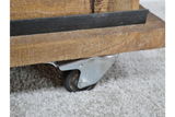 The rustic cabinet features a sturdy wooden base with a textured finish and is equipped with a metal caster wheel for easy mobility on soft surfaces
