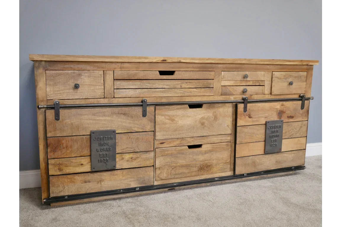 Industrial style sideboard with natural wood finish, metal sliding doors and multiple drawers