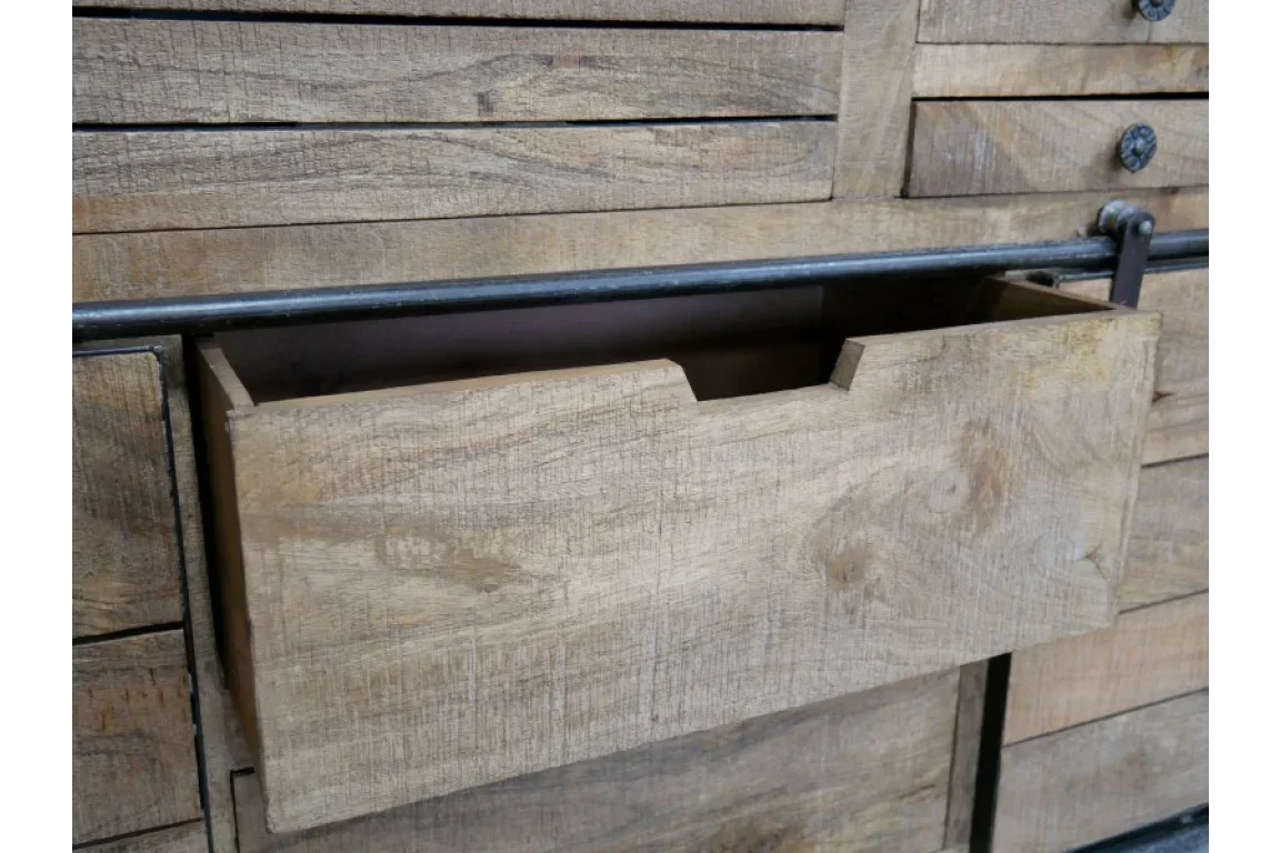 Rustic wooden chest of drawers with open drawer and metal rail detailing