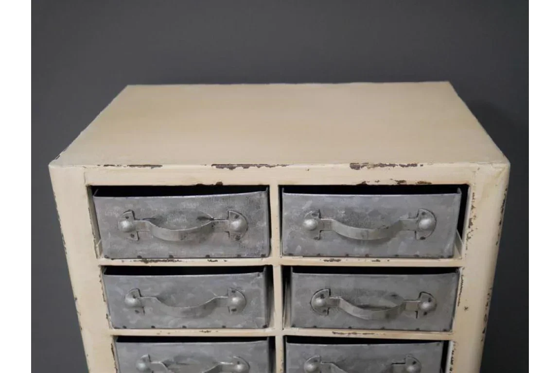 Rustic cream storage cabinet with six metal drawers and vintage handles