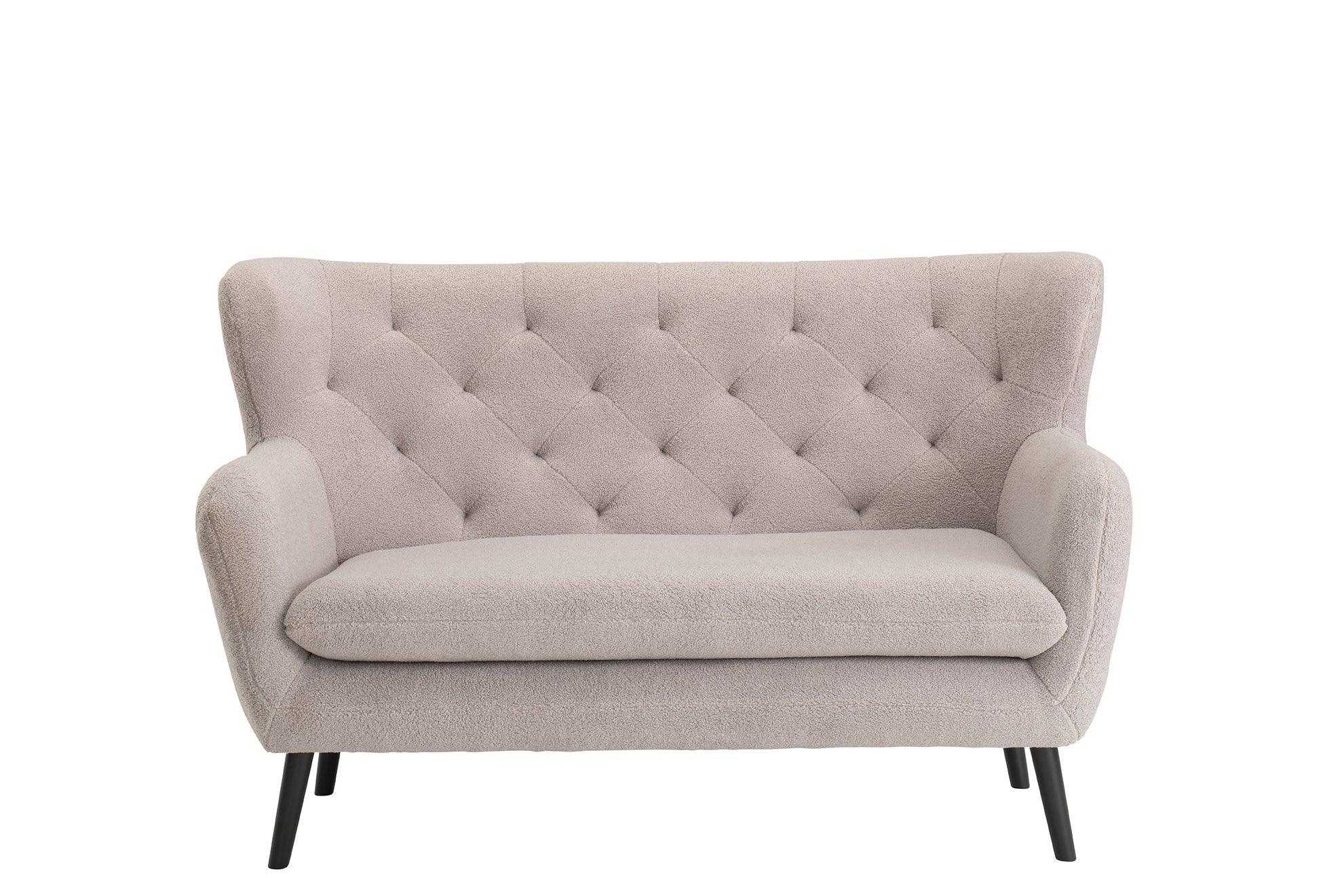 Beige fabric sofa with tufted backrest and black angled legs, front view