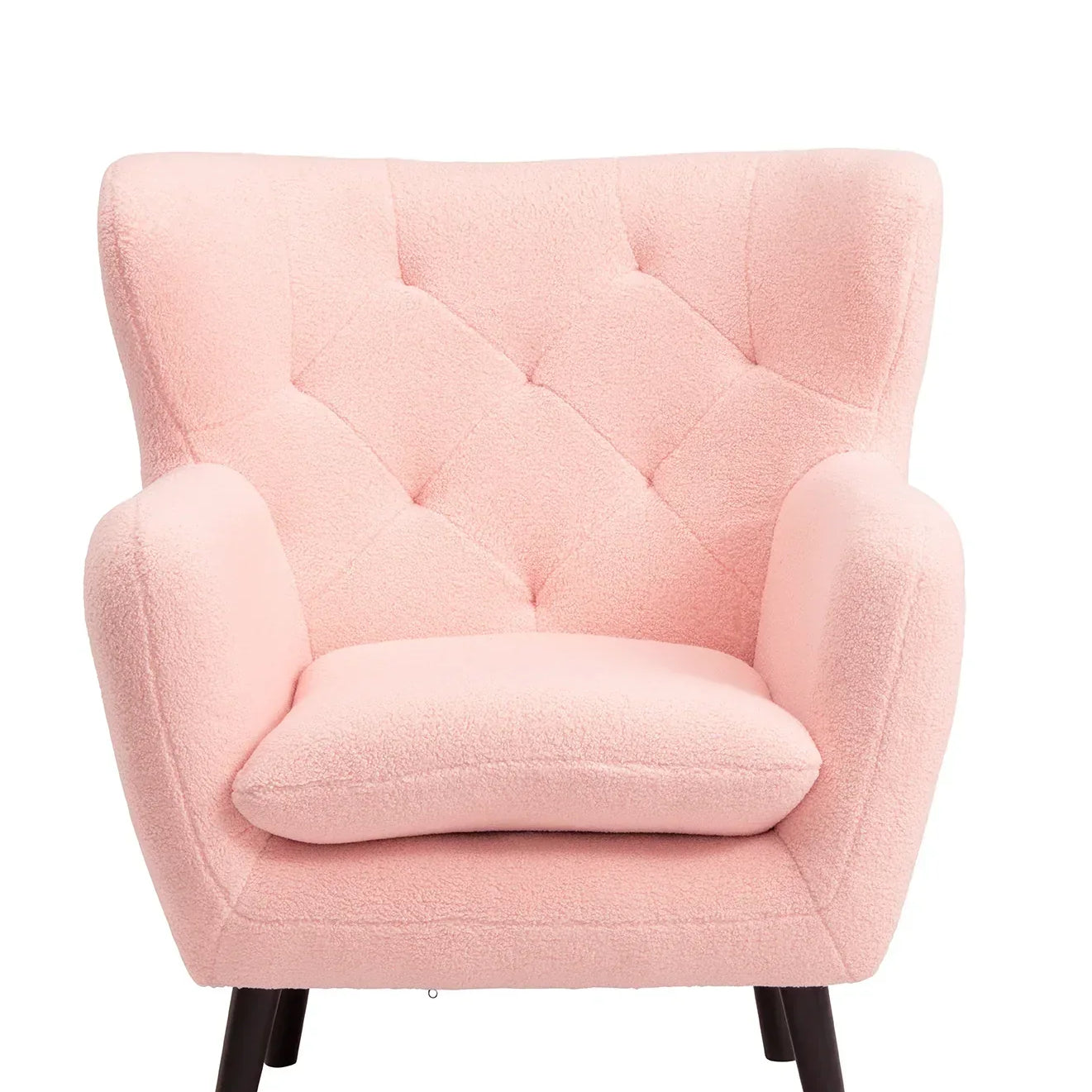 Pink armchair with tufted backrest and black wooden legs, front view