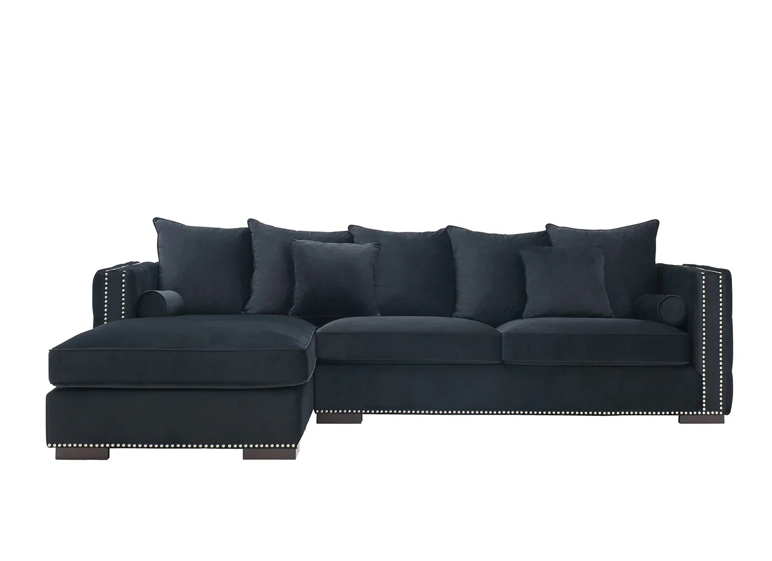 Black corner sofa with studded trim and multiple back cushions on white background