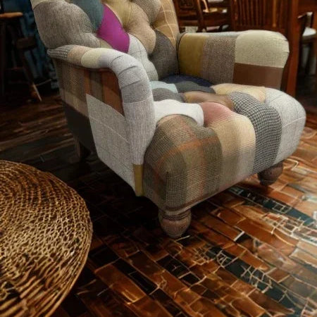 Patchwork fabric armchair with tufted backrest in cozy dining room setting