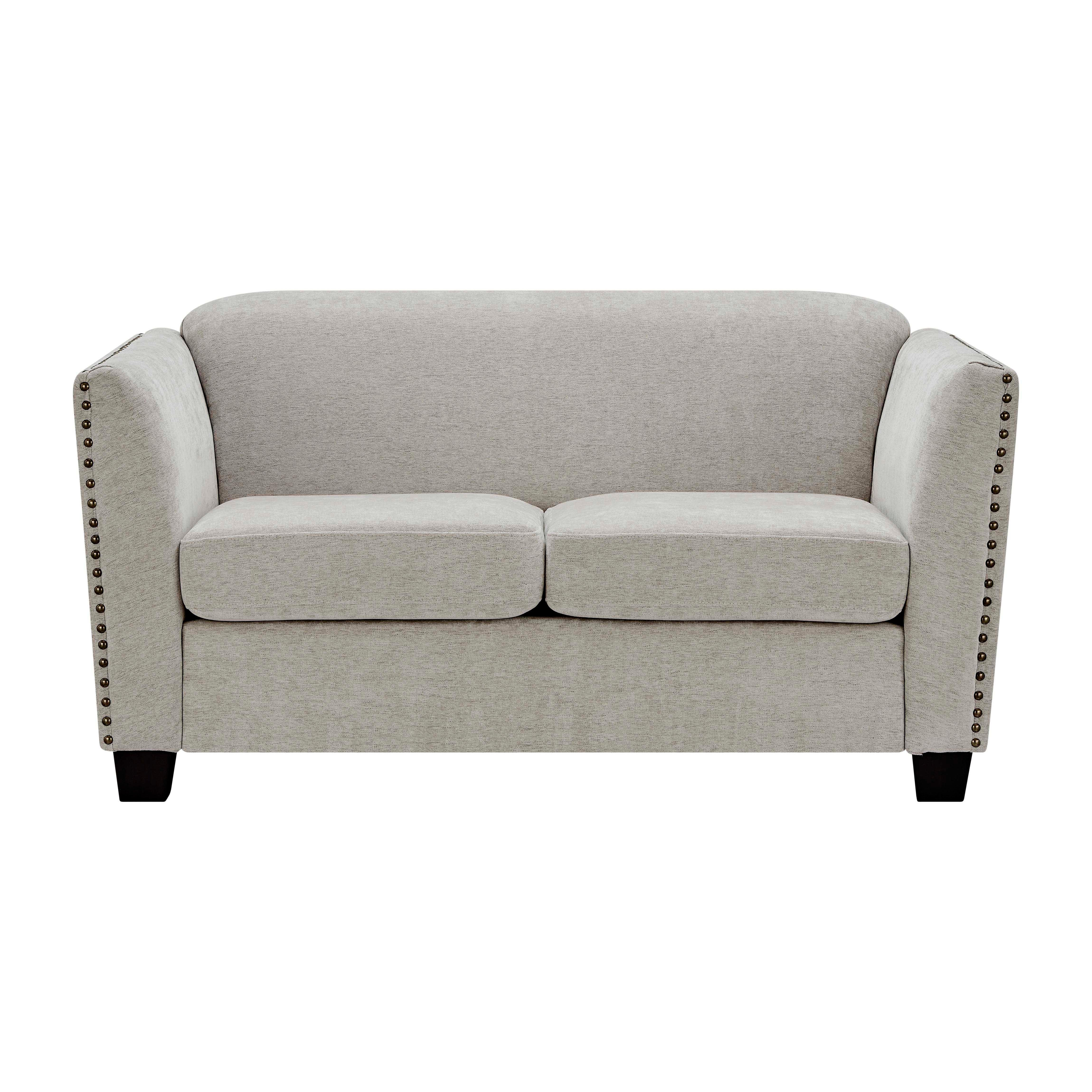 Light grey fabric sofa with nailhead trim and two seat cushions, front view