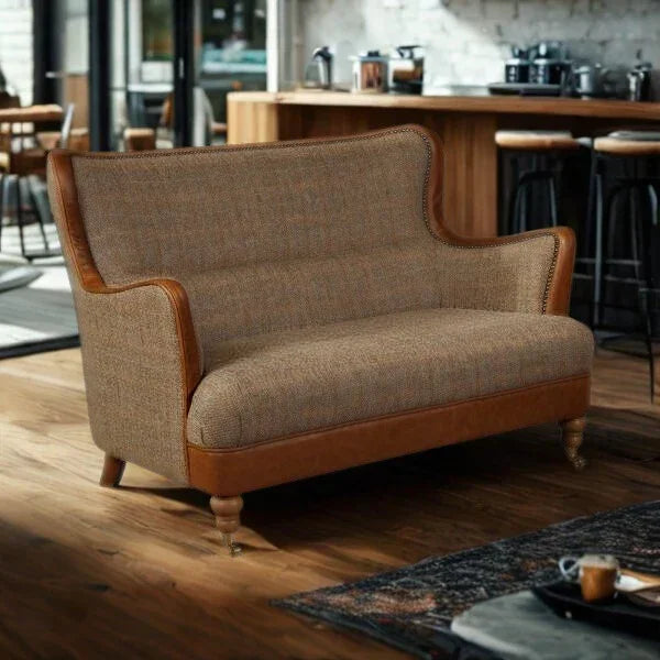 Brown fabric and leather two-seater sofa with wooden legs in modern living room