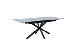 A rectangular dining table with a gray stone-look top and a black metal X-shaped pedestal base, shown on a plain white background.