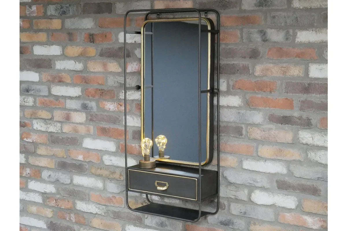 Industrial wall mirror with metal frame, single drawer, and two exposed bulbs against brick wall