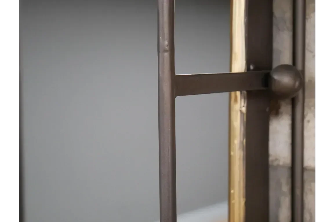 Close up of black metal frame detail on industrial style mirror