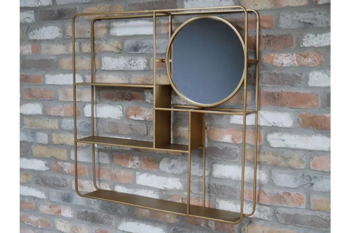 Gold metal wall shelf unit with round mirror and open compartments on brick wall