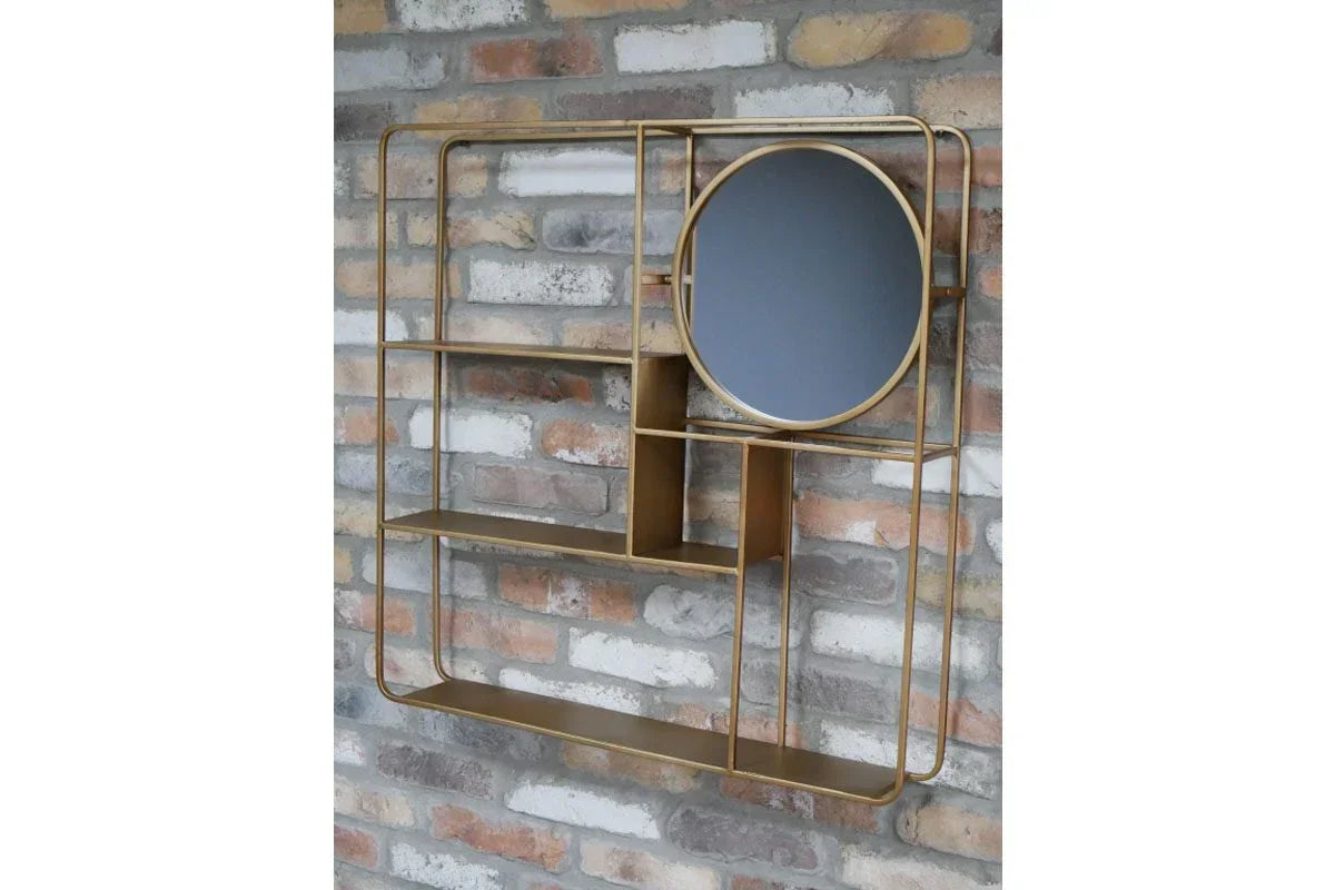 Gold metal wall shelf with geometric shelves and round mirror against brick wall