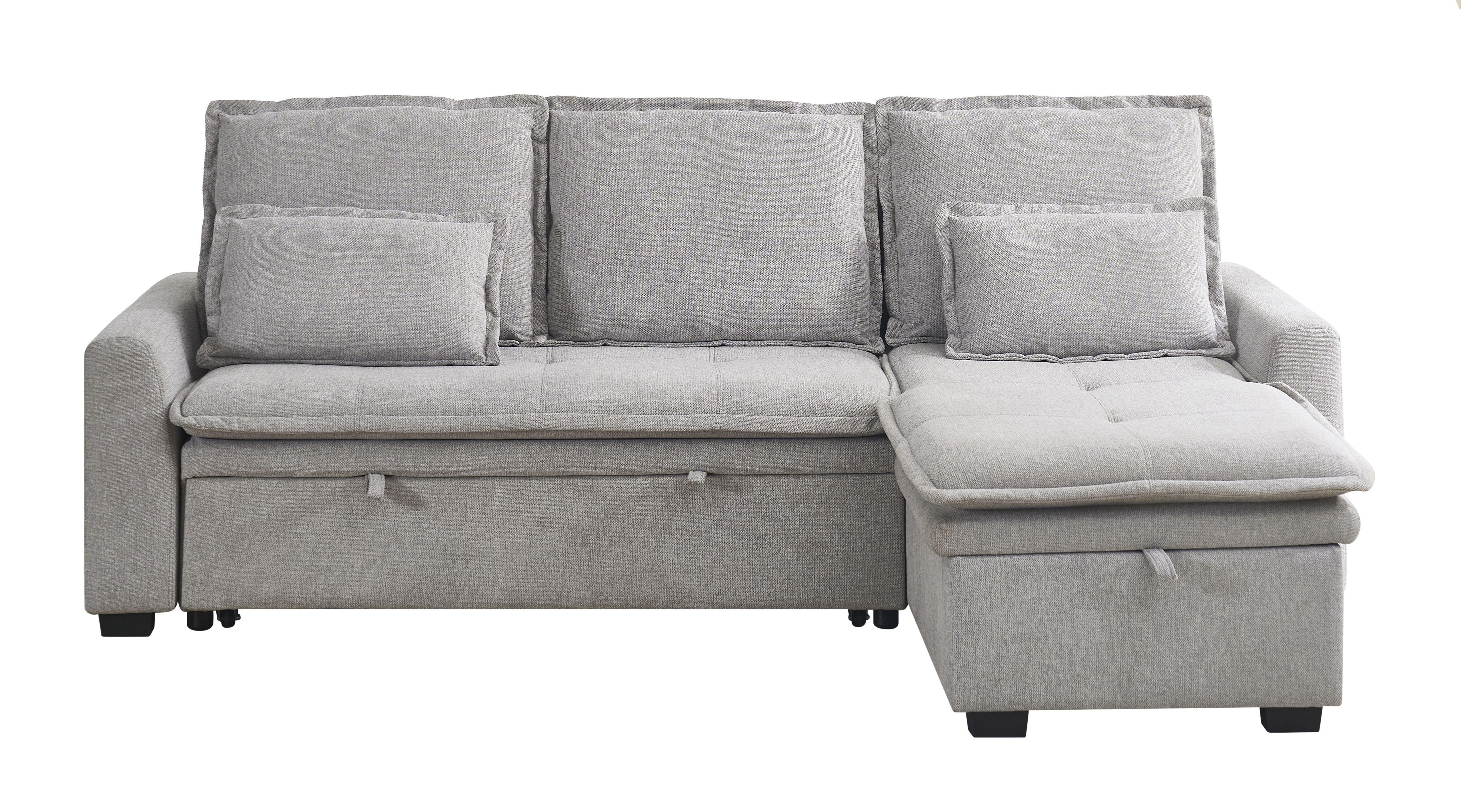 Grey fabric corner sofa with storage chaise and scatter cushions, front view