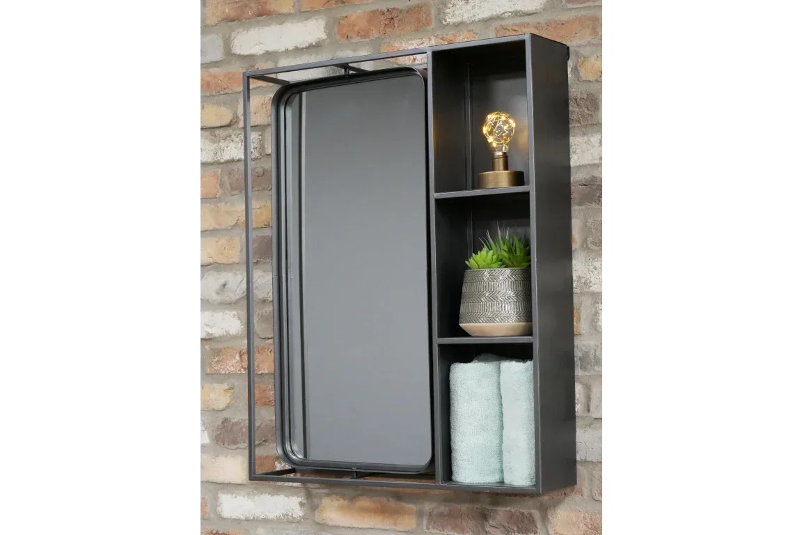 Black metal bathroom cabinet with mirror, shelves holding towel, plant, and decorative light