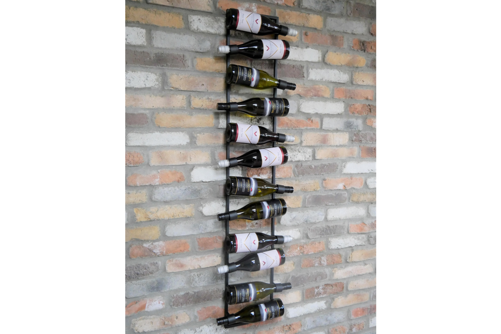 Vertical black metal wine bottle holder mounted on exposed brick wall, storing ten bottles horizontally.