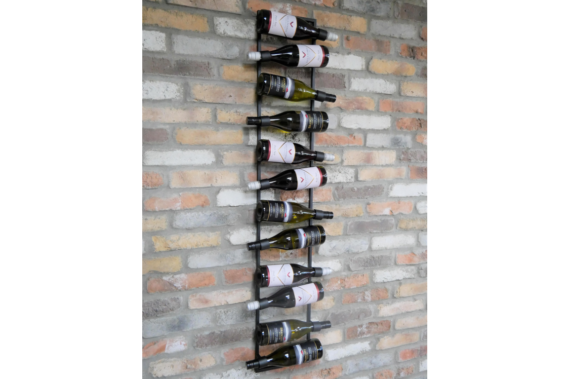 Vertical black metal wine bottle holder mounted on exposed brick wall, storing ten bottles horizontally.
