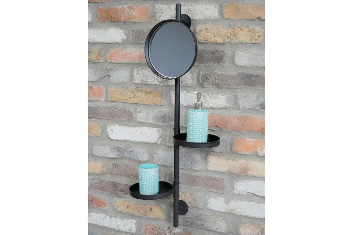Black bathroom wall shelf with round mirror and two trays holding soap dispenser and tumbler
