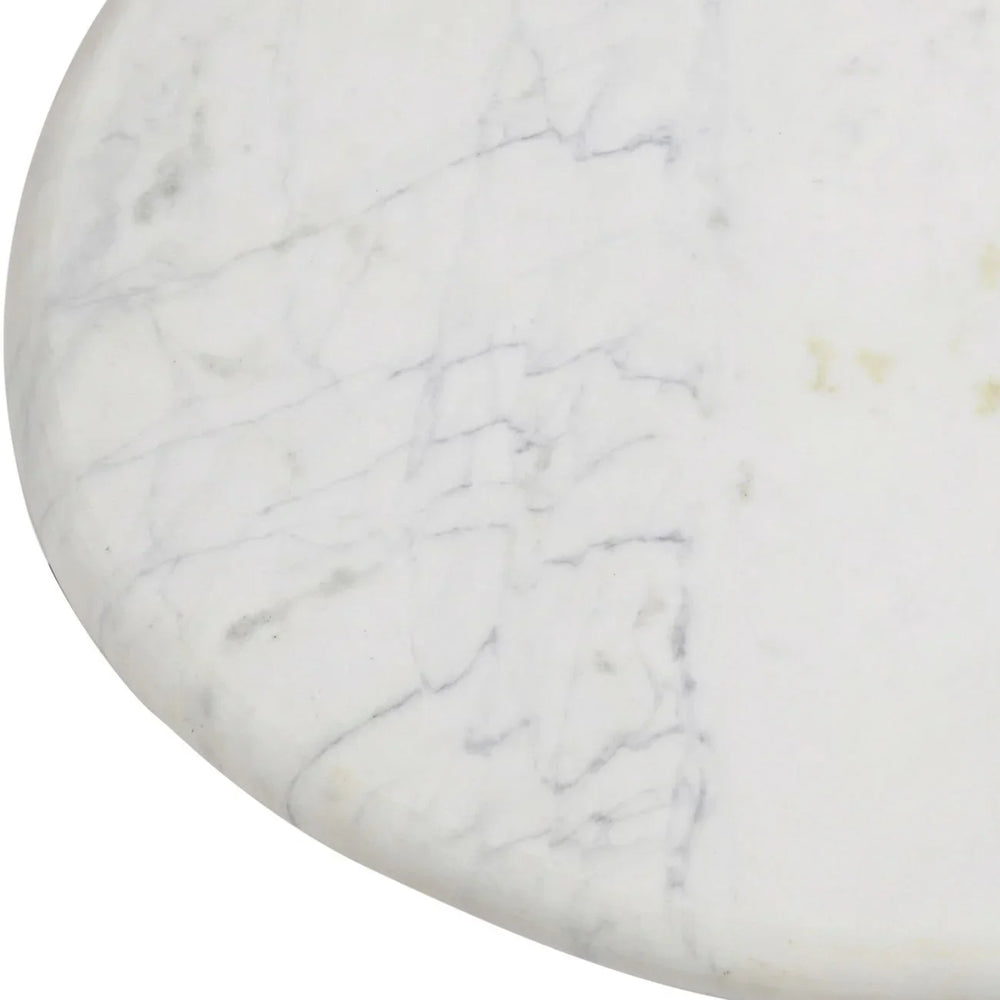 White marble surface with subtle grey veining detail.