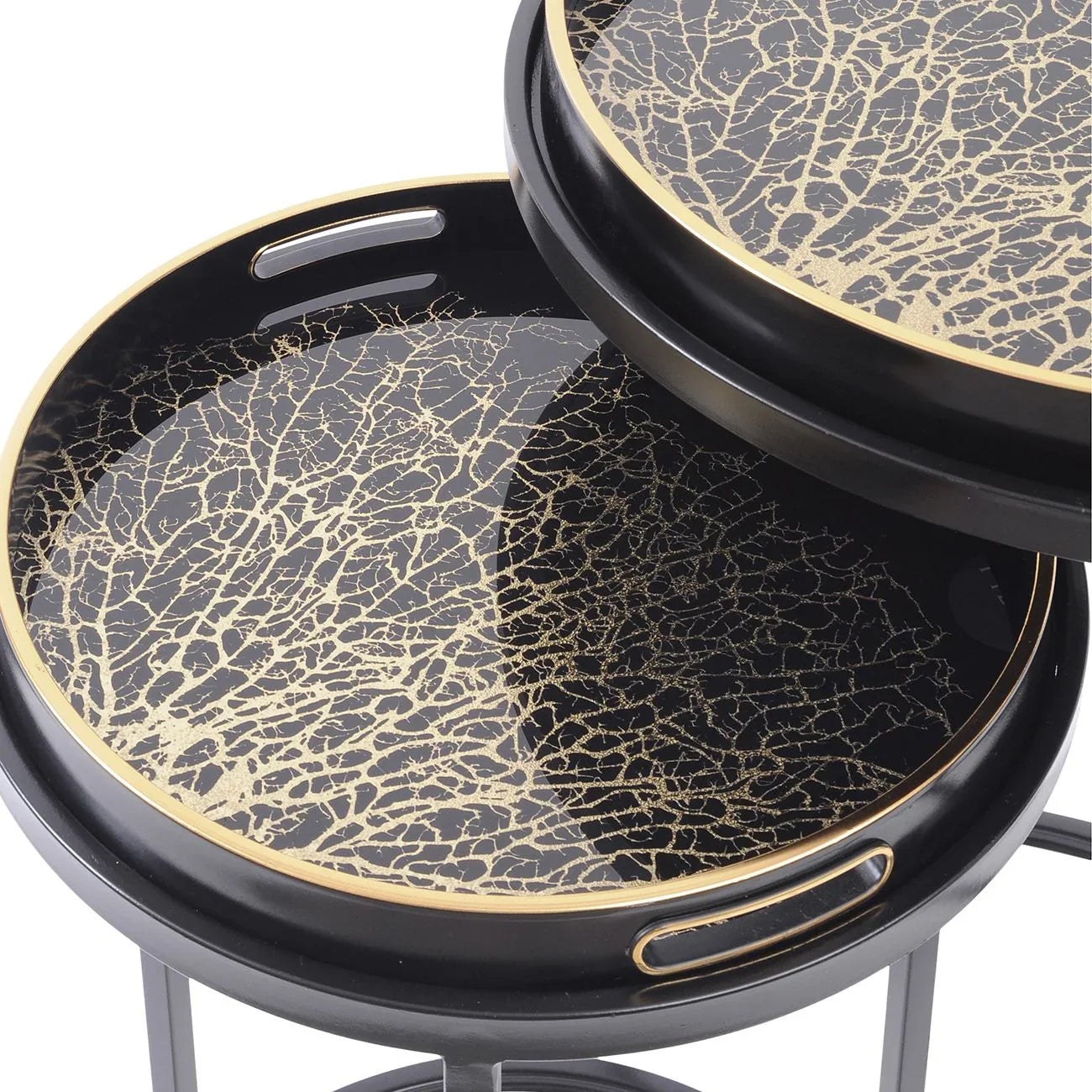 Black and gold tray tables with intricate coral pattern design.