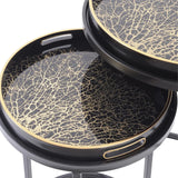Black and gold tray tables with intricate coral pattern design.