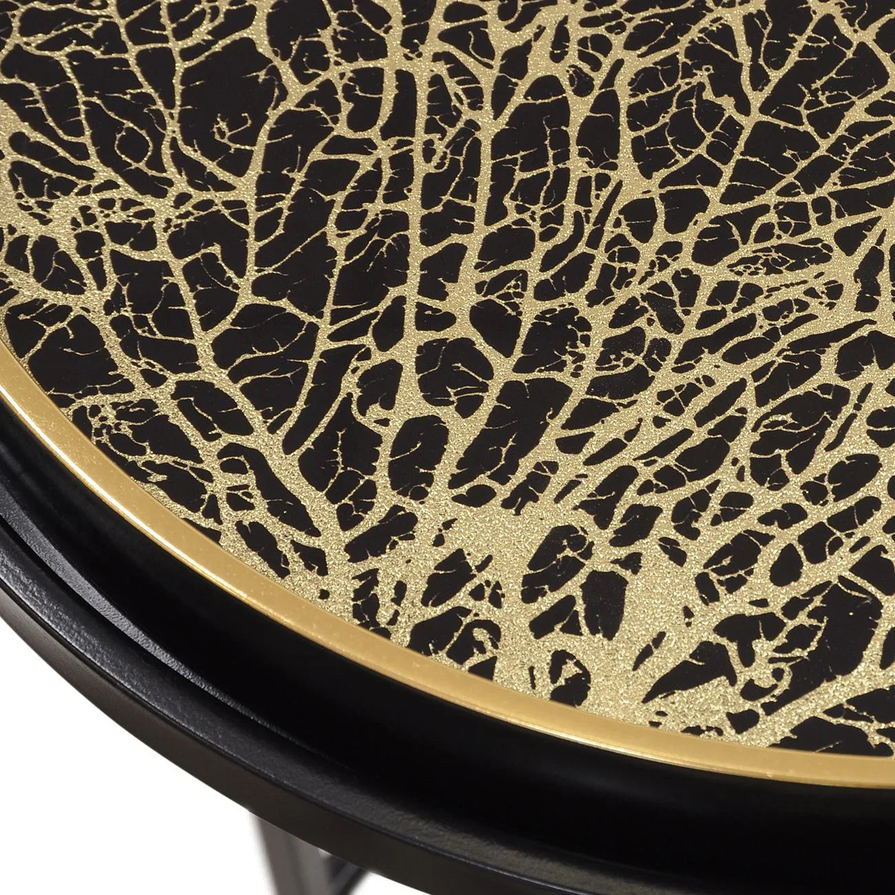 Gold and black tray table with intricate coral pattern design.
