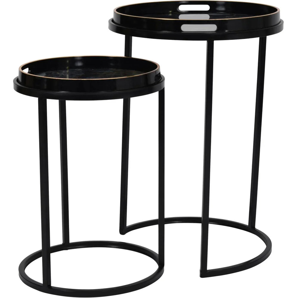 Black and gold round tray tables with sleek metal frames.