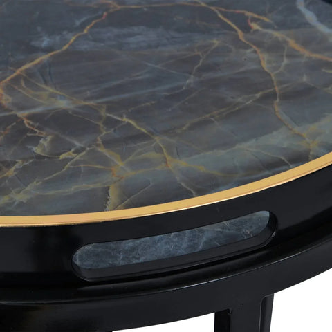 Black and gold tray table with marble-like surface detail.