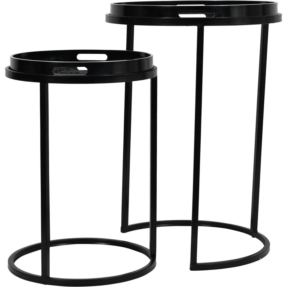 Black metal side tables with circular tops and slender legs.