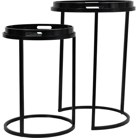 Black metal side tables with circular tops and slender legs.