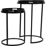 Black metal side tables with circular tops and slender legs.