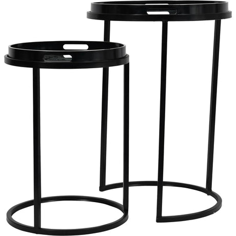 Black metal side tables with circular tops and slender legs.