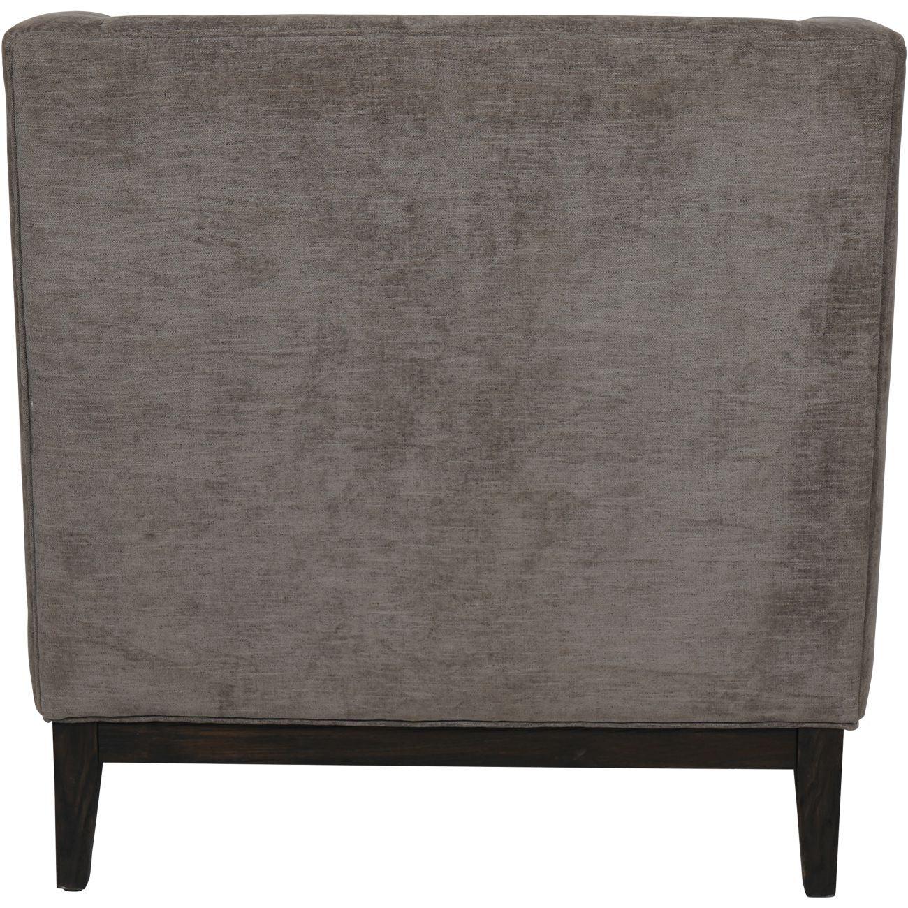 Back view of grey fabric armchair with dark wooden legs.
