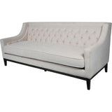 Ivory fabric sofa with buttoned backrest and sleek black legs.