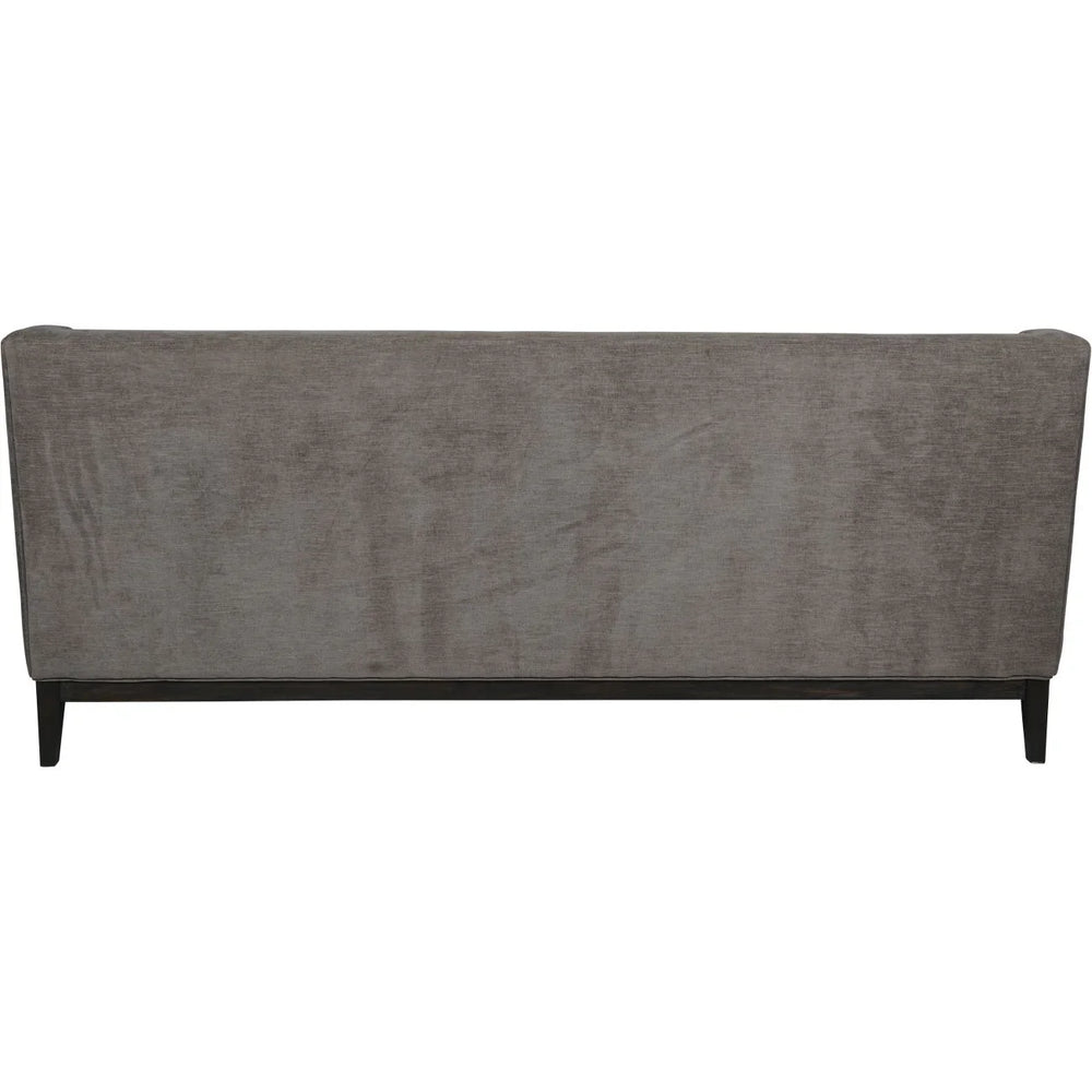 Warm grey fabric sofa back view with sleek black legs.