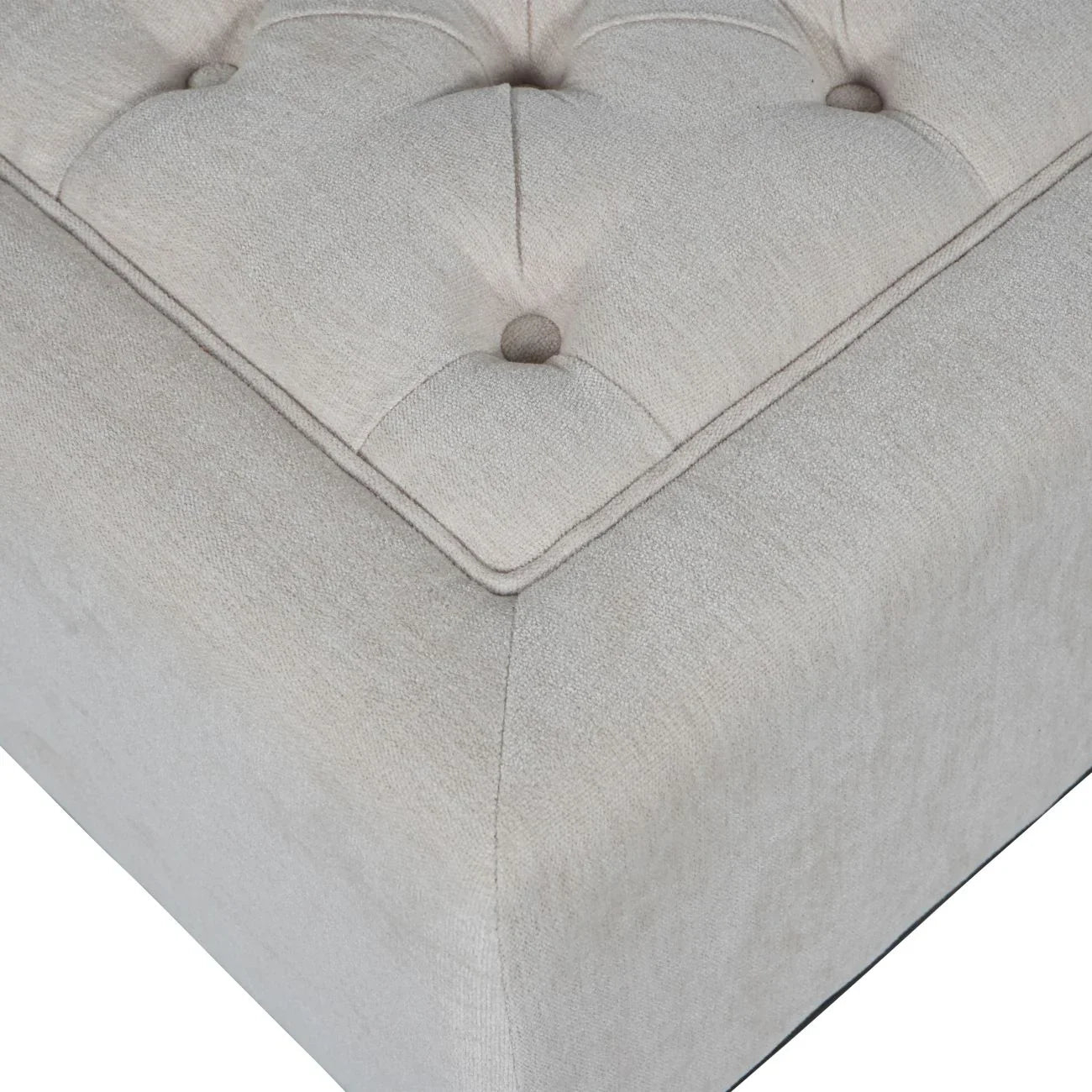 Ivory fabric stool corner with button-tufted detail