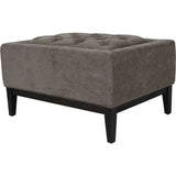 Warm grey fabric stool with buttoned top and dark wooden legs.