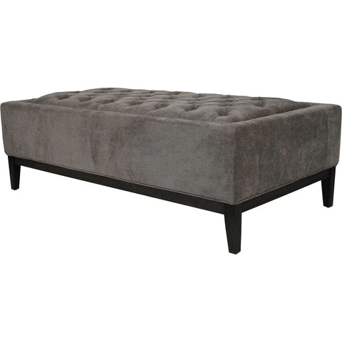 Warm grey ottoman with buttoned fabric and dark wooden legs