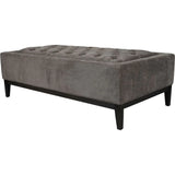 Warm grey ottoman with buttoned fabric and dark wooden legs