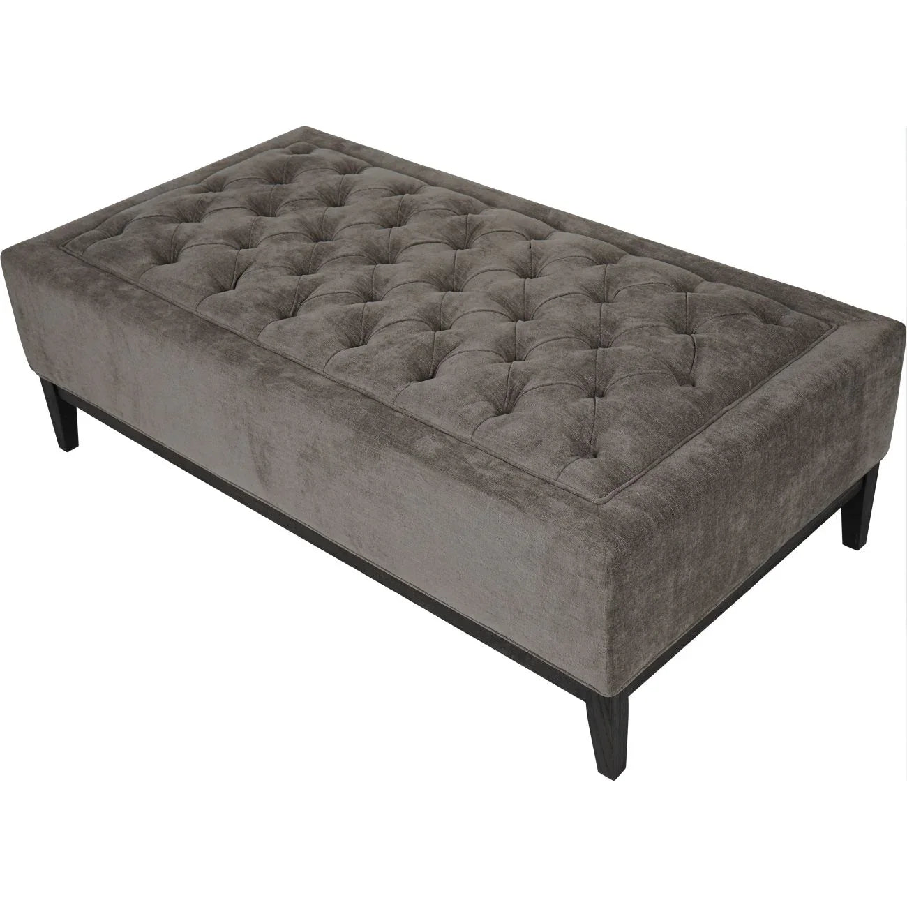 Warm grey fabric ottoman with buttoned top and dark wooden legs.