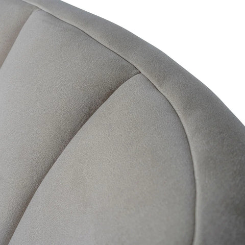 Taupe chair back with soft, textured upholstery and subtle stitching.