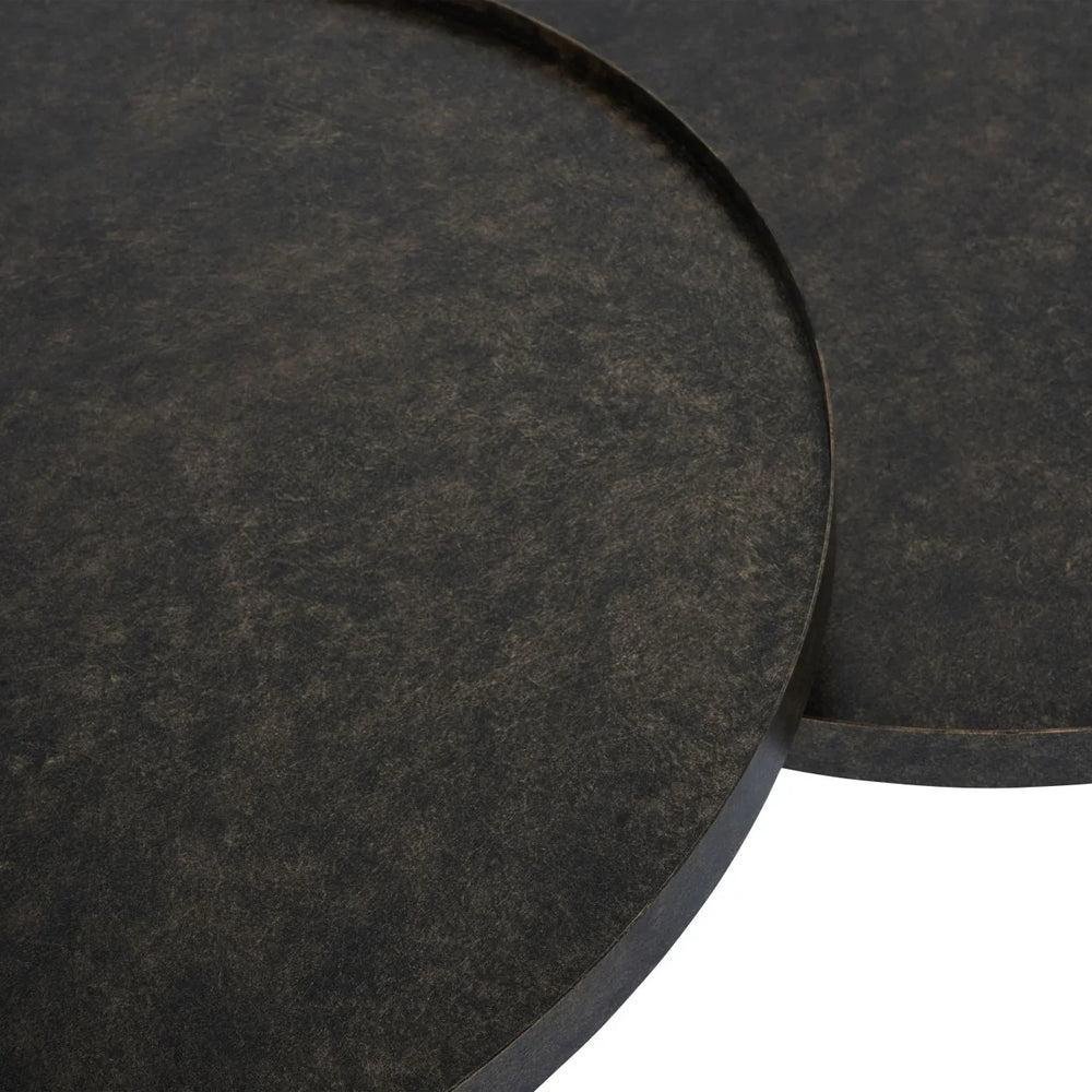 Rustic antique gold iron table tops with textured surface detail.