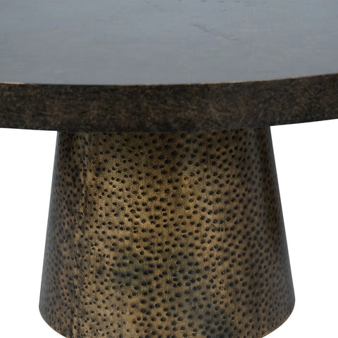 Dark tabletop with textured antique gold base detail.