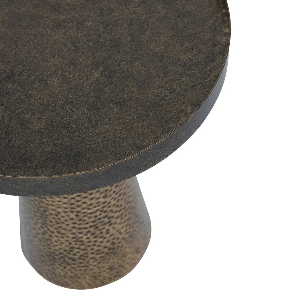 Dark round table top with textured, hammered base in antique gold.